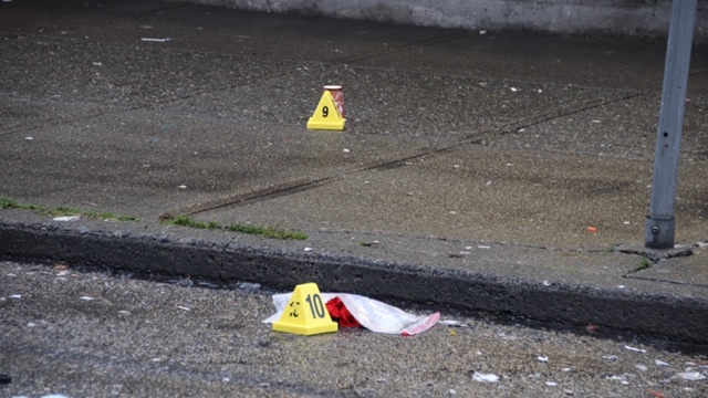 Evidence markers near shooting scene at Hastings Street and Dunlevy Avenue.
