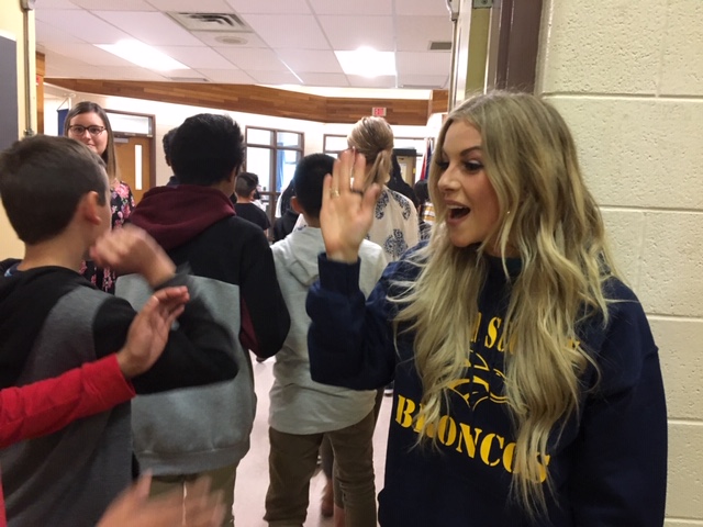 Lindsay Ell greets students at Calgary’s Father Scollen School after presenting the school with a $15,000 grant for musical instruments from the MusiCounts Band Aid program.