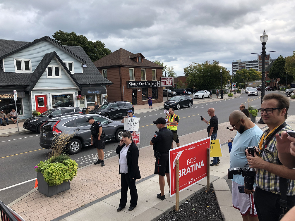 Several protesters greeted Trudeau outside of MP Bob Bratina’s campaign office on Monday.