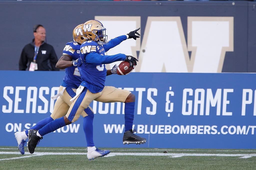Winnipeg Blue Bombers' Winston Rose (30) celebrates his interception of the pass intended for Saskatchewan Roughriders' Shaq Evans (1) during the second half of CFL action in Winnipeg Saturday, September 7, 2019. THE CANADIAN PRESS/John Woods.