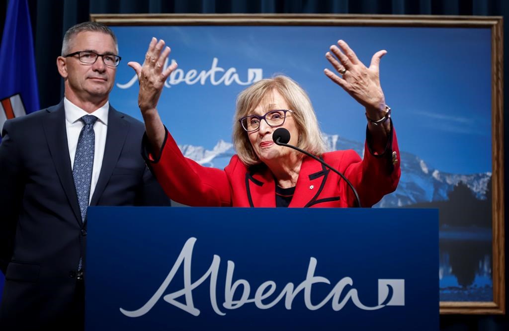 Janice MacKinnon, right, chair of the Blue Ribbon Panel on Alberta’s Finances, and Travis Toews, Minister of Finance, speaks to the media about the MacKinnon Panel report on Alberta’s Finances in Calgary, Alta., Tuesday, Sept. 3, 2019.THE CANADIAN PRESS/Jeff McIntosh.