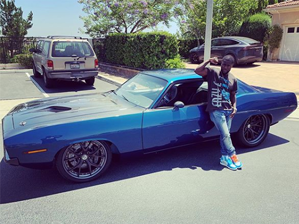 Kevin Hart with his 1970 Plymouth Barracuda before it was totalled in a car crash on Sunday, Sept. 1.