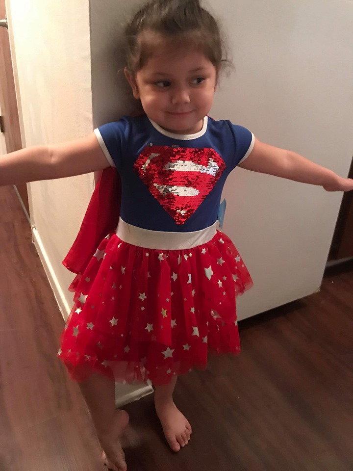 Lydia Calculli, 3, is shown in her Supergirl dress.