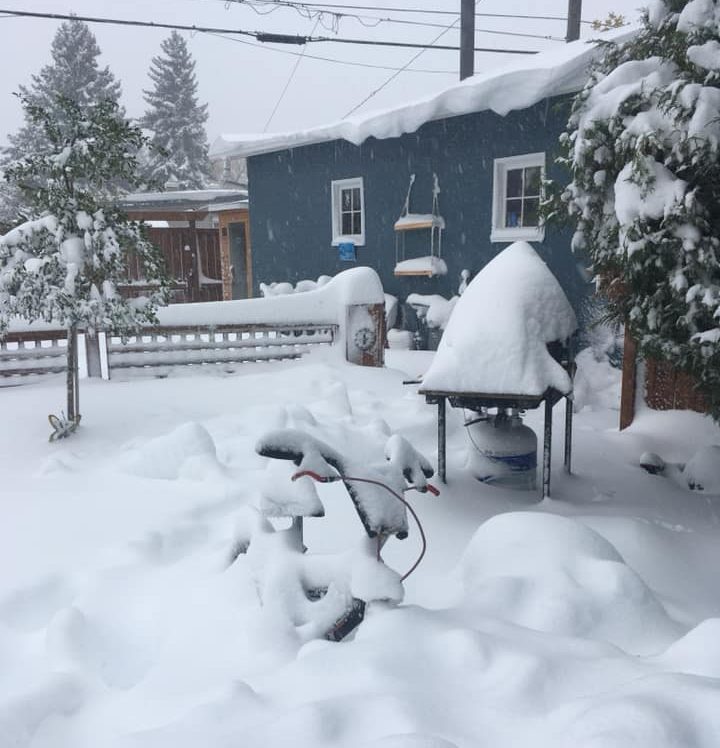 Snow piled high in a Lethbridge yard on Sunday, Sept. 29, 2019.