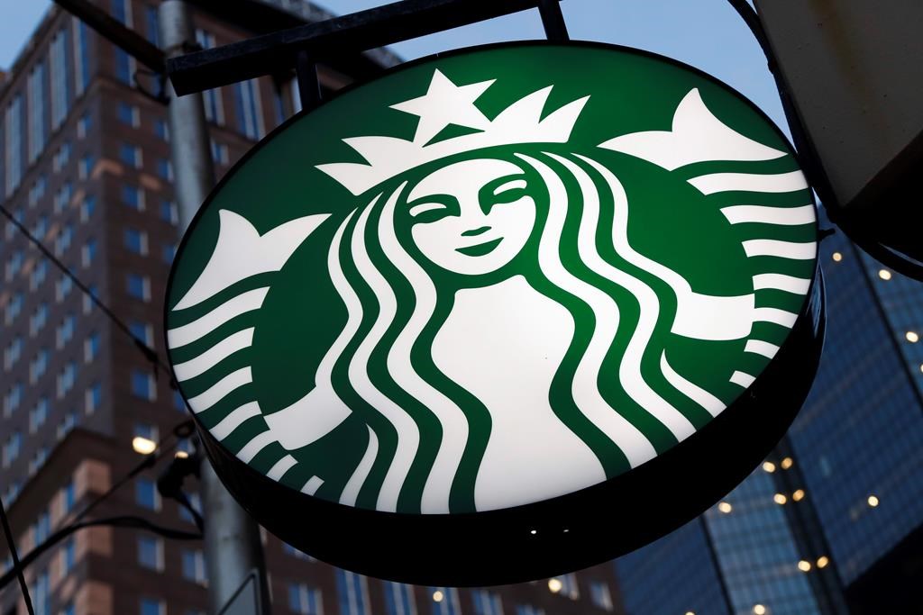 FILE - This June 26, 2019 file photo shows a Starbucks sign outside a Starbucks coffee shop in downtown Pittsburgh.
