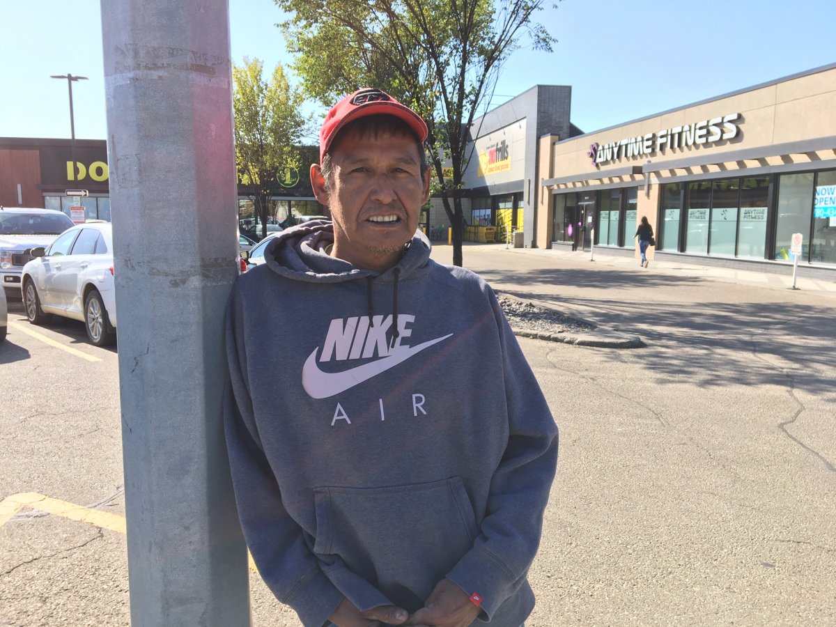 Mark Callihoo stands beside the plaza at Calgary Trail and 80 Avenue where he was pepper sprayed by a security guard.
