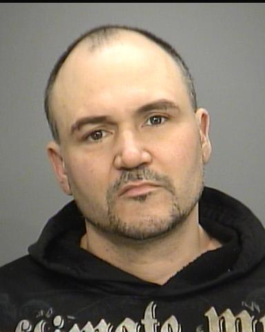Police say 42-year-old Christopher McLeod is wanted on 26 outstanding charges of failure to comply with probation, among other offences.