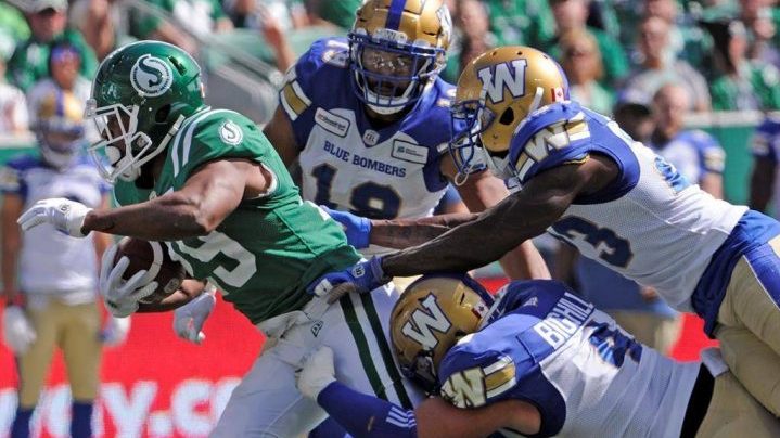Saskatchewan Roughriders running back William Powell fights for yards during first half CFL action against the Winnipeg Blue Bombers, in Regina on Sunday, Sept. 1, 2019.