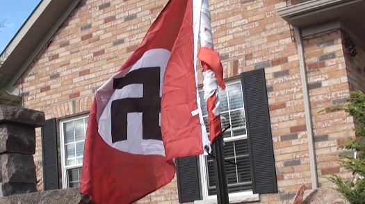 Cobourg police are investigating after a flag with a hate symbol was put up at west-end home.