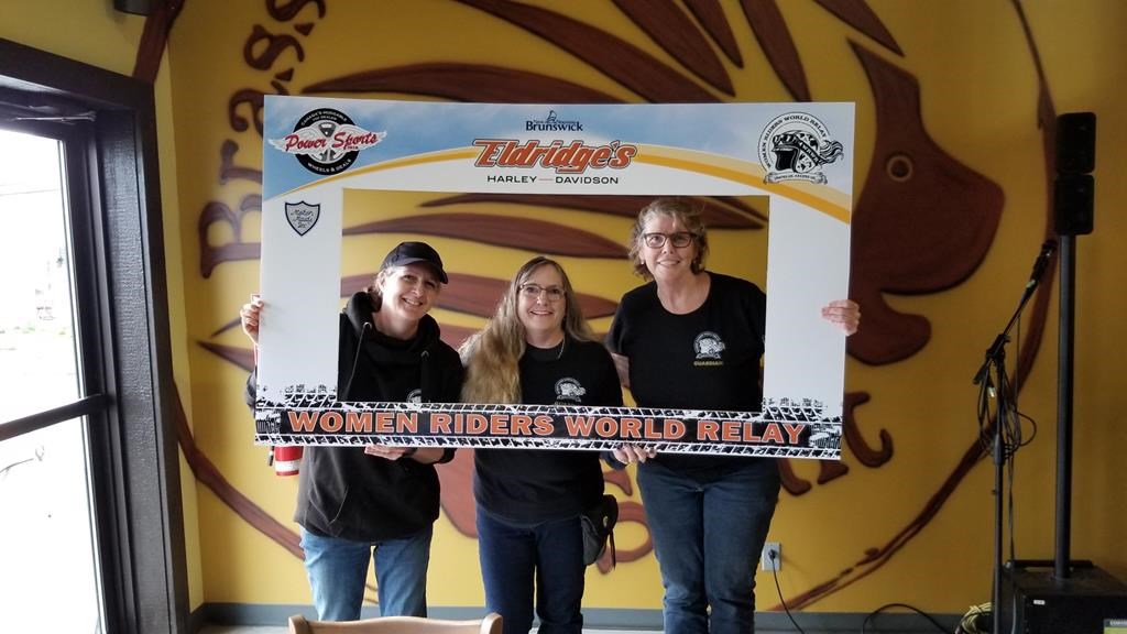 Organizers of the New Brunswick leg of a motorcycle relay Valerie Kilfoil (left to right), Heather Scott Moreau and Catherine Lawrence are shown in a handout photo. A women's motorcycle relay that's making it's way around the world, has completed it's Canadian leg and passed the baton off to the United States.