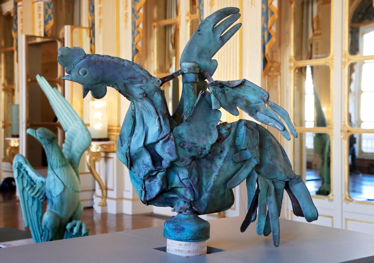 The rooster which plunged to the ground during the fire Notre Dame cathedral is displayed at the Culture Ministry in Paris, Friday, Sept. 20, 2019. The rooster, long a symbol of France, tumbled to the ground in the April blaze that consumed the cathedral's roof and collapsed its spire. The bird somehow survived, and is going on public display this weekend.