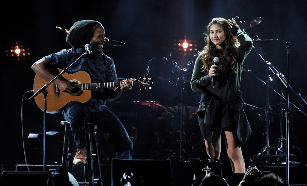 This Jan. 16, 2019 file photo shows Toni Cornell, right, daughter of the late singer Chris Cornell, performing with Ziggy Marley during ‘I Am The Highway: A Tribute to Chris Cornell’ in Inglewood, Calif.