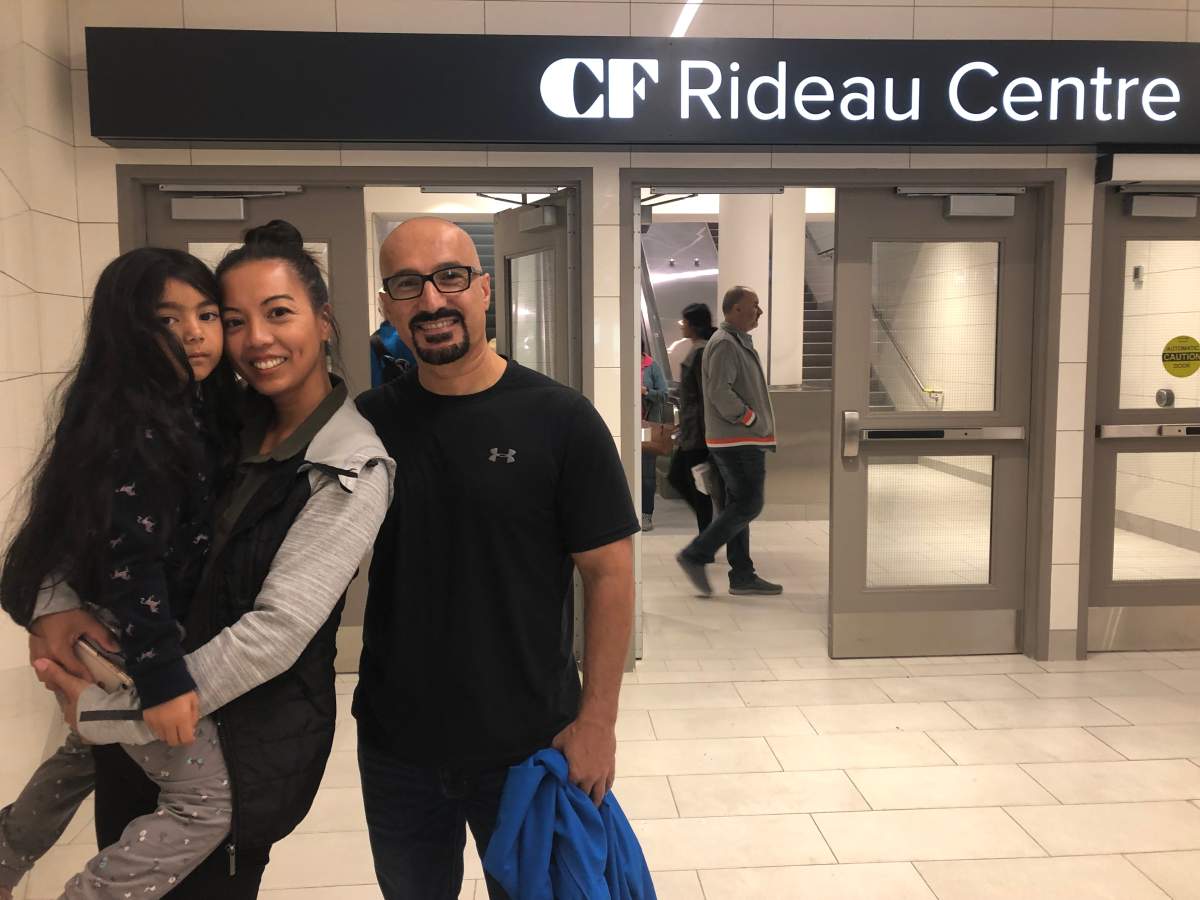 Barrhaven resident Dee Dava (centre) rode Ottawa’s Confederation Line from Tunney’s Pasture to Rideau station with her family on the LRT system’s first day in operation.