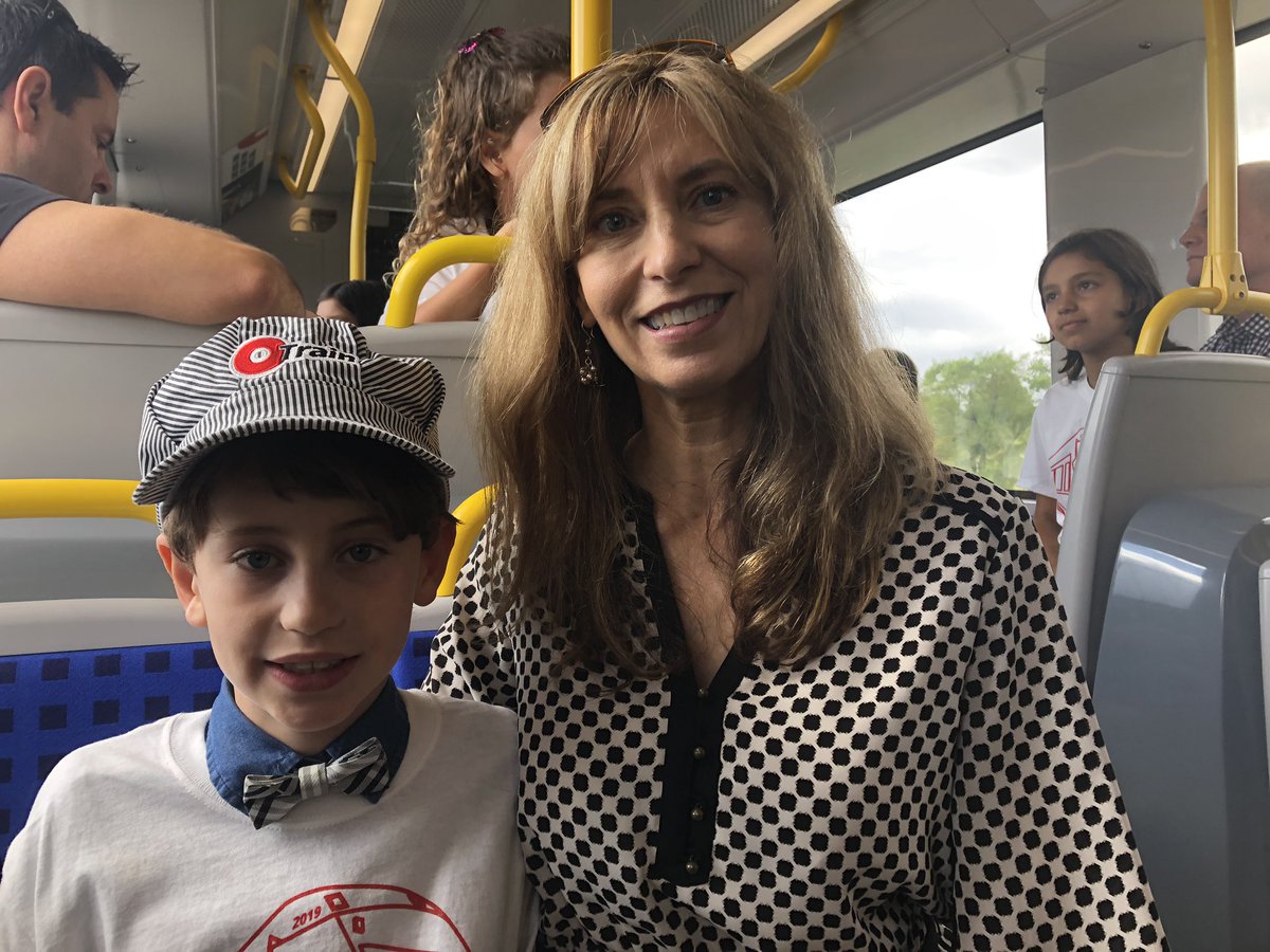 Tay Reeves (left) and his mom Dana Reid (right) were invited to board the Confederation Line for the train’s inaugural ride on Saturday morning, before the public launch. Reeves was one of the “Name the Trains” contest winners for his submission: Inuksuk.