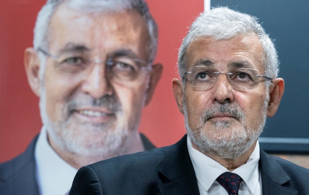 Imam Hassan Guillet, who has been dropped by the Liberal party as a candidate, listens to a question during a news conference in Montreal on Wednesday, September 4, 2019.