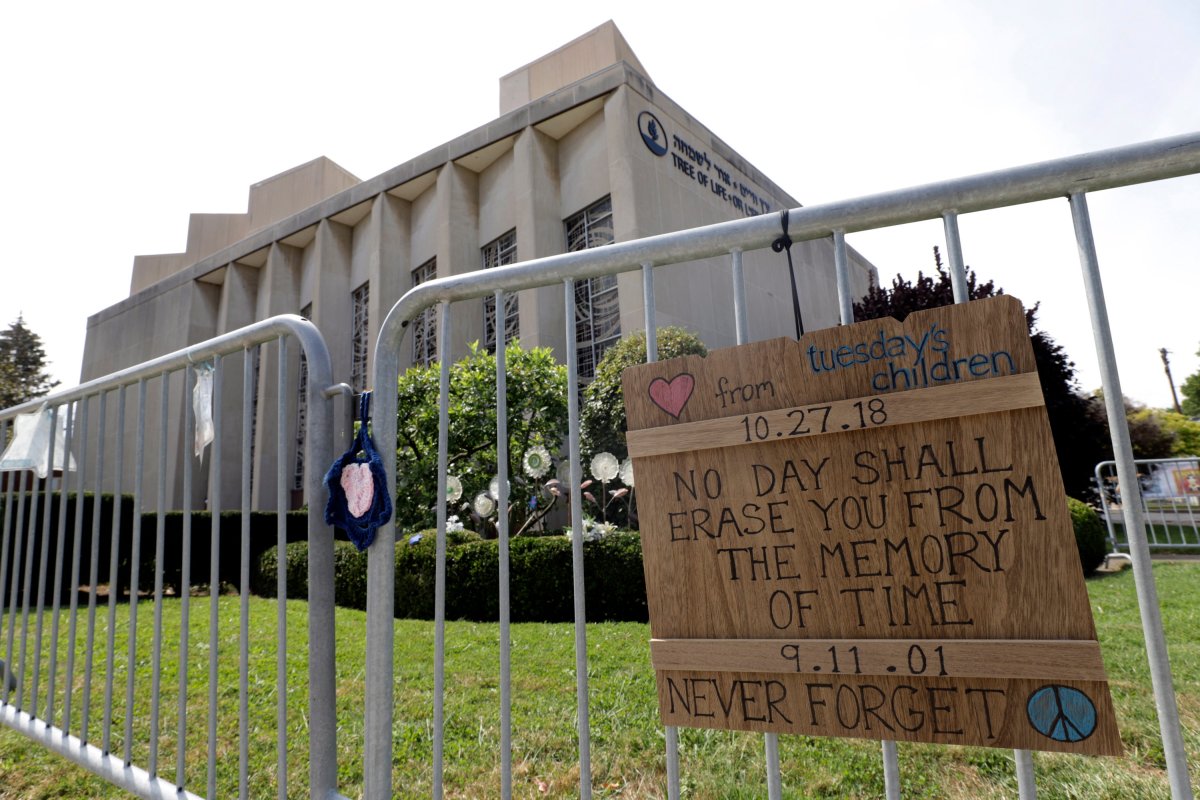 A sign hangs on a fence surrounding the Tree of Life synagogue in Pittsburgh on Tuesday, Sept. 17, 2019. The first anniversary of the shooting at the synagogue, that killed 11 worshippers, is Oct., 27, 2019. Authorities charged Robert Bowers, 47, a truck driver from Baldwin, Pennsylvania, in the attack that killed eight men and three women, and wounded seven others inside Tree of Life synagogue, where congregants from New Light and Dor Hadash also had gathered. Bowers has pleaded not guilty. He faces the death penalty if convicted.