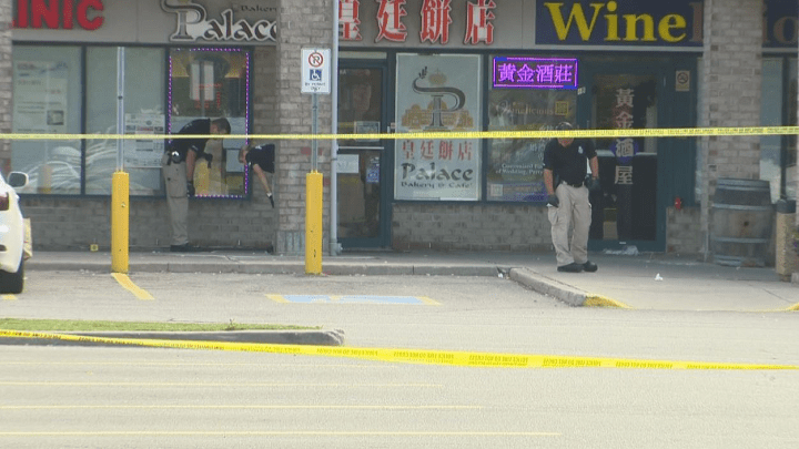 Investigators at the scene of the shooting on Saturday.