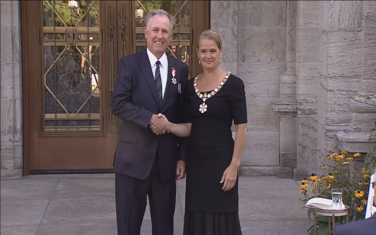 Ron Foxcroft receiving the Order of Canada medal from Governor General Julie Payette.