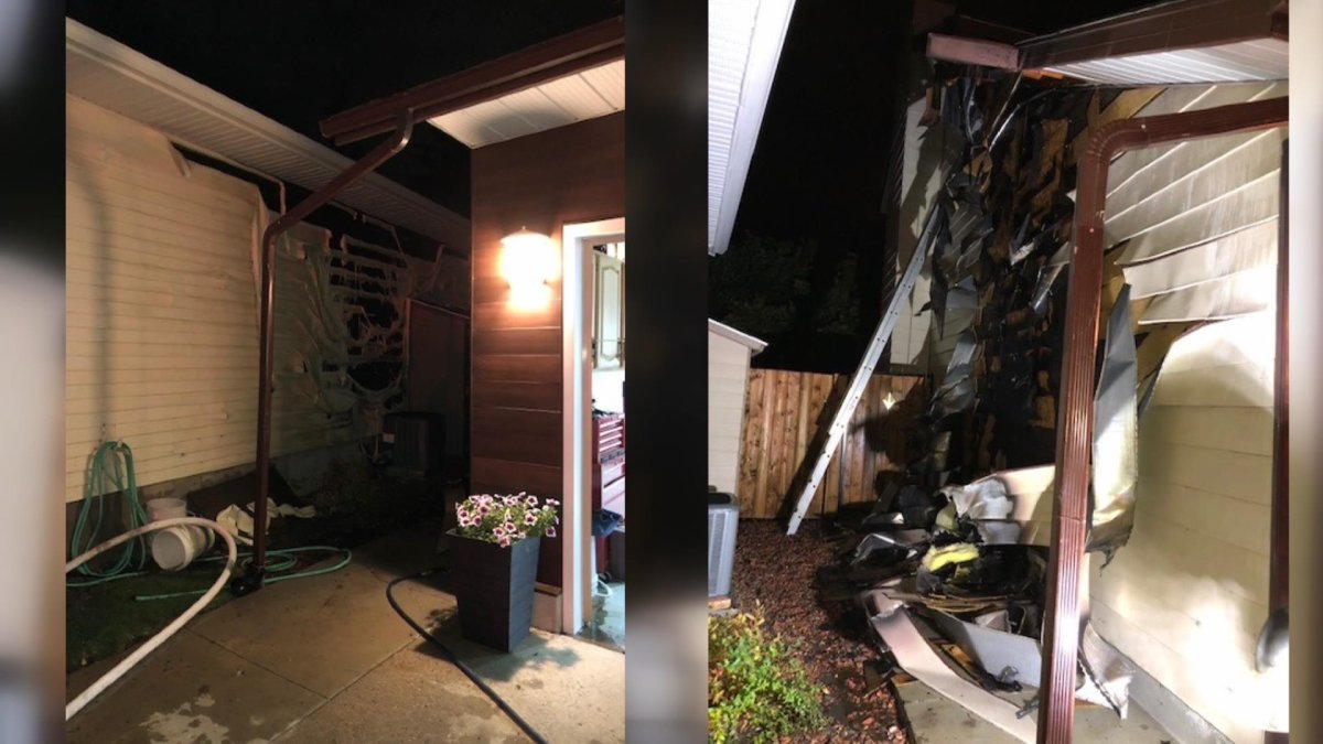 A neighbour used a garden hose prior to Saskatoon firefighters arriving to prevent a garage fire from spreading on Sept. 8, 2019.