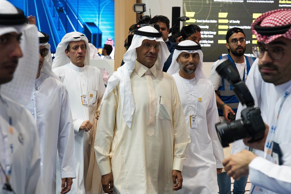 Saudi Arabia's new Energy Minister Prince Abdulaziz bin Salman, center, and United Arab Emirates Energy Minister Suhail al-Mazrouei, right, walk through an energy exhibition in Abu Dhabi, United Arab Emirates, Monday, Sept. 9, 2019. 