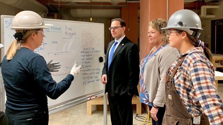 Advanced Education Minister Nicolaides and MLA Jackie Armstrong-Homeniuk participates in a demonstration at Women Building Futures with class lead Deanna Currie, and Shawna Cloutier, student.
