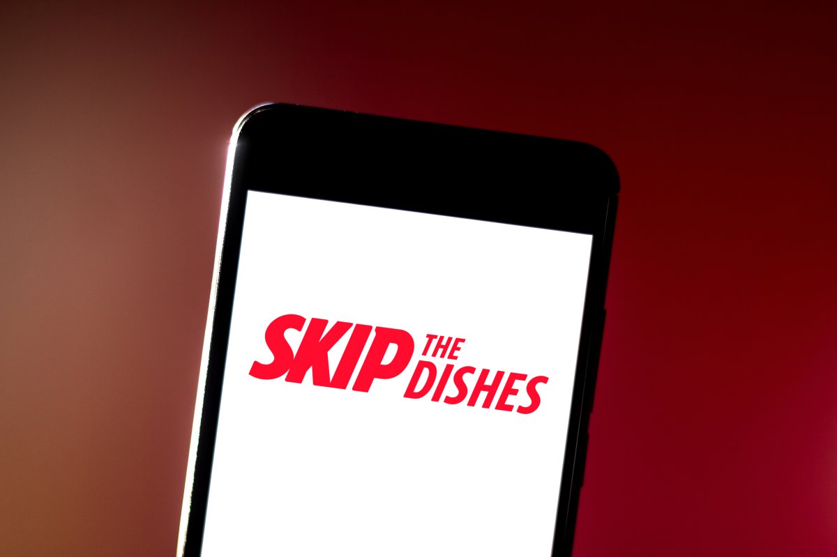 In this photo illustration the SkipTheDishes Restaurant Services logo is seen displayed on a smartphone. 