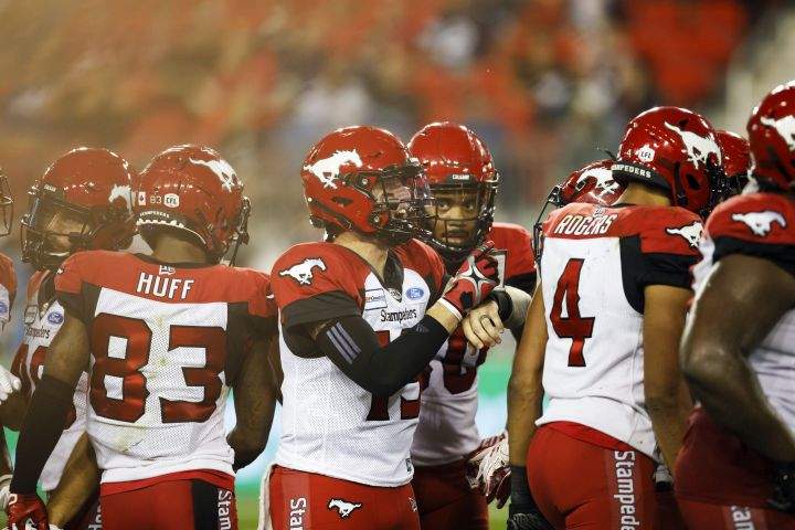 Calgary Stampeders quarterback Bo Levi Mitchell (19) yells out orders at the start of a down during the second half of CFL action against the Toronto Argonauts in Toronto, Friday, Sept. 20, 2019. 