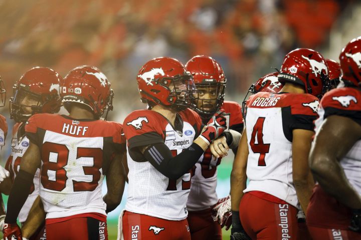 Calgary Stampeders quarterback Bo Levi Mitchell (19) yells out orders at the start of a down during the second half of CFL action against the Toronto Argonauts in Toronto, Friday, Sept. 20, 2019. 