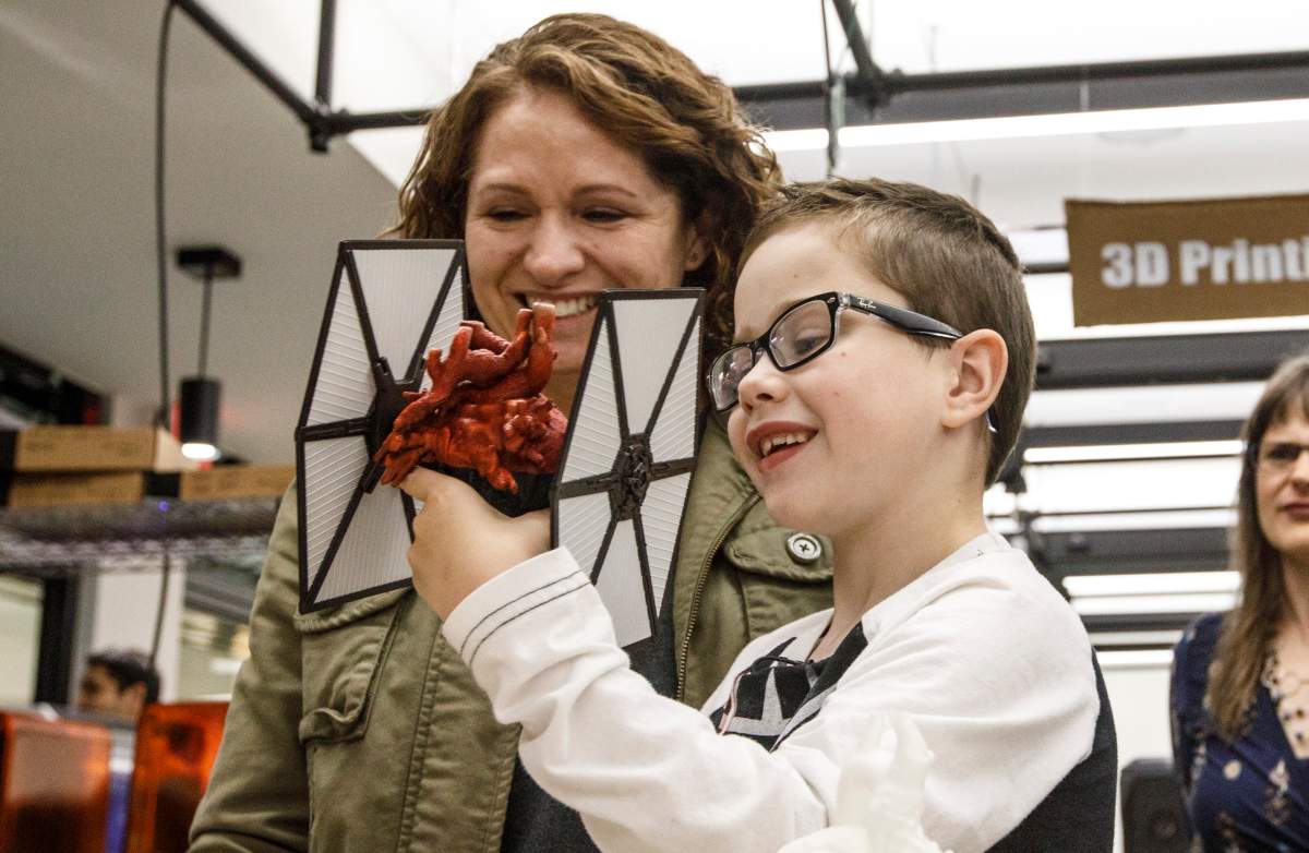 Mason Thomas and his mom look over a 3D model of Mason’s heart in Edmonton Alta, on Wednesday September 11, 2019.