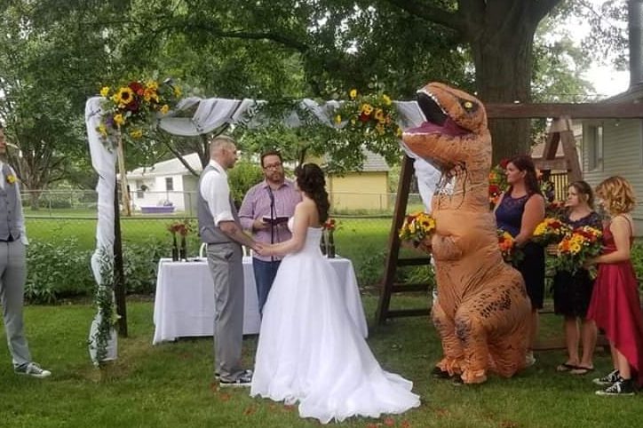 Christina Meador is shown inside a T. rex costume at her sister's wedding in Nebraska in August 2019.