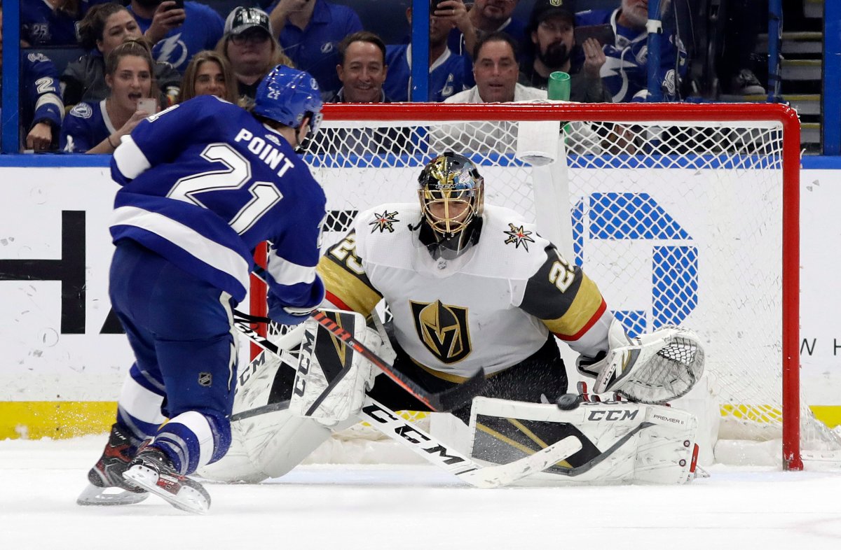 Vegas Golden Knights goaltender Marc-Andre Fleury (29) stops a shot by Tampa Bay Lightning center Brayden Point (21) during a shootout in an NHL hockey game Tuesday, Feb. 5, 2019, in Tampa, Fla.