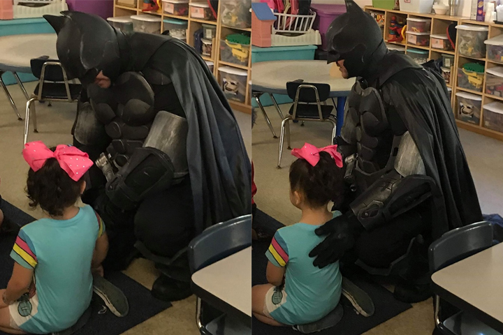 Batman impersonator Jack Asbury III is shown with Lydia Calculli, 3, at her daycare in Spring Hill, Fla., on Aug. 28, 2019.