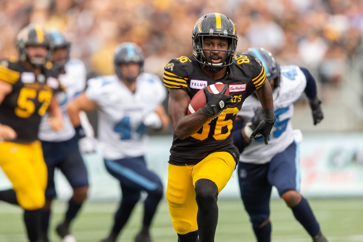 Hamilton's Bralon Addison scores a touchdown during fourth quarter CFL action between the Tiger-Cats and the Argos in Hamilton, Ontario on Monday, September 2, 2019.