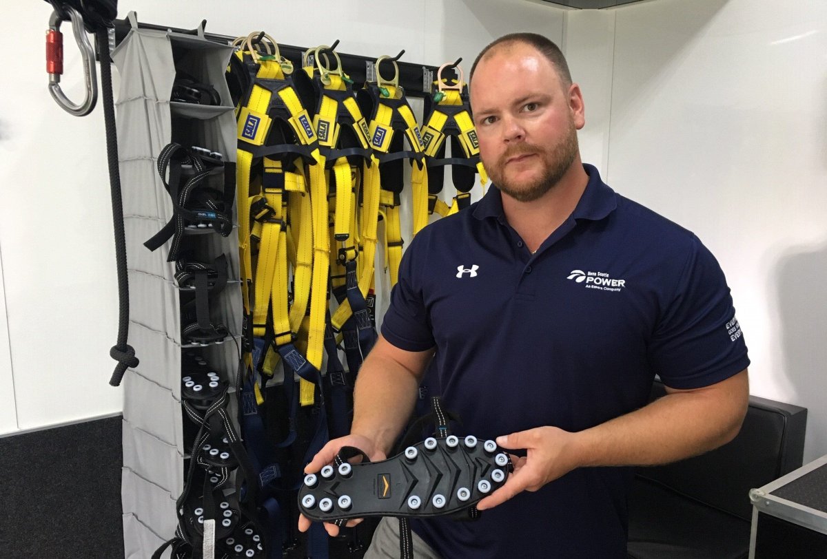 Ryan MacBurnie shows off the shoe slider that Nova Scotia Power hopes will help prevent workplace accidents.