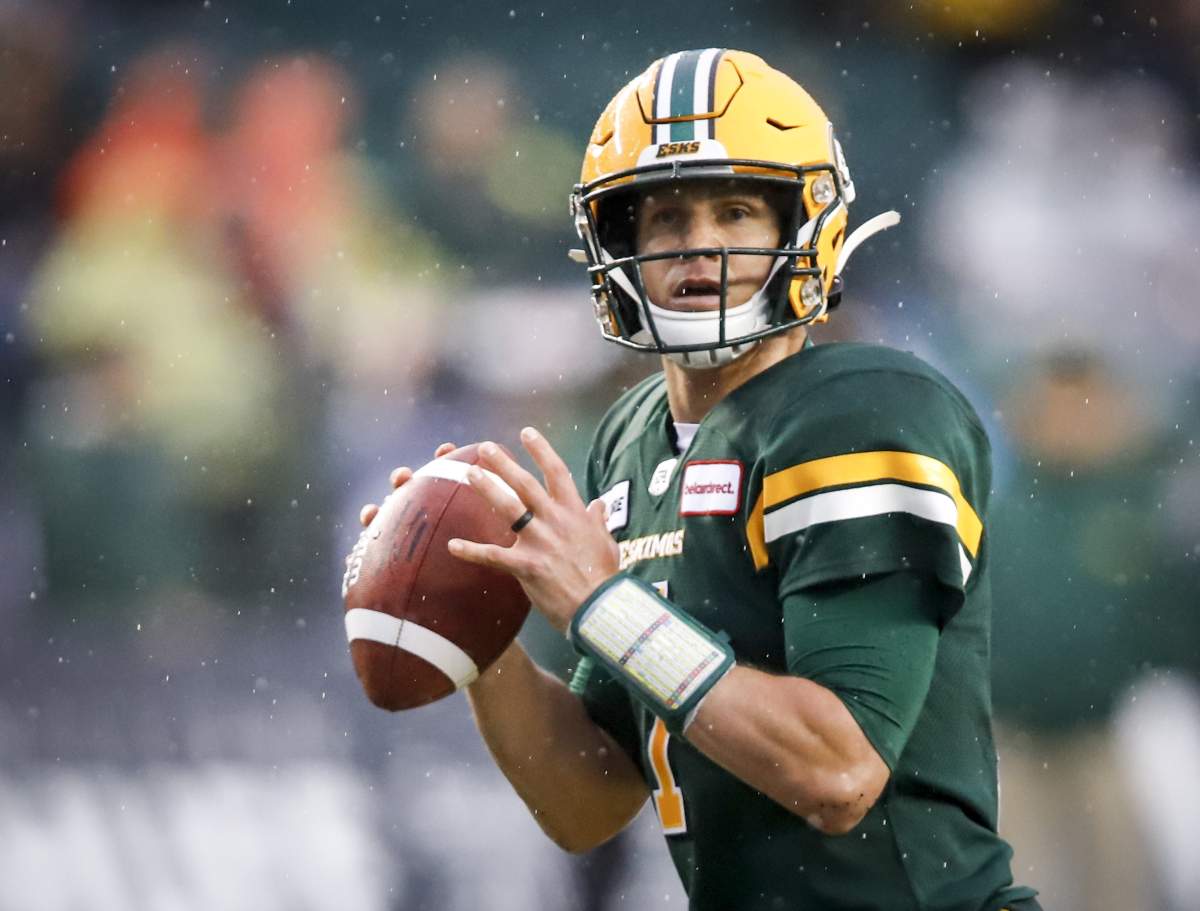 Edmonton Eskimos quarterback Trevor Harris looks for a receiver during first half CFL football action against the Winnipeg Blue Bombers in Edmonton, Friday, Aug. 23, 2019.  