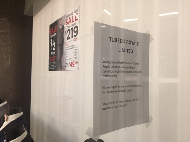 A sign on the window of Tuxedo Royale Limited in Mississauga.