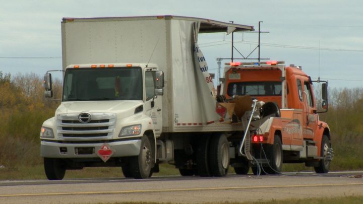 The Saskatoon Fire Department said the collision between a cube van and a semi created a large debris field.