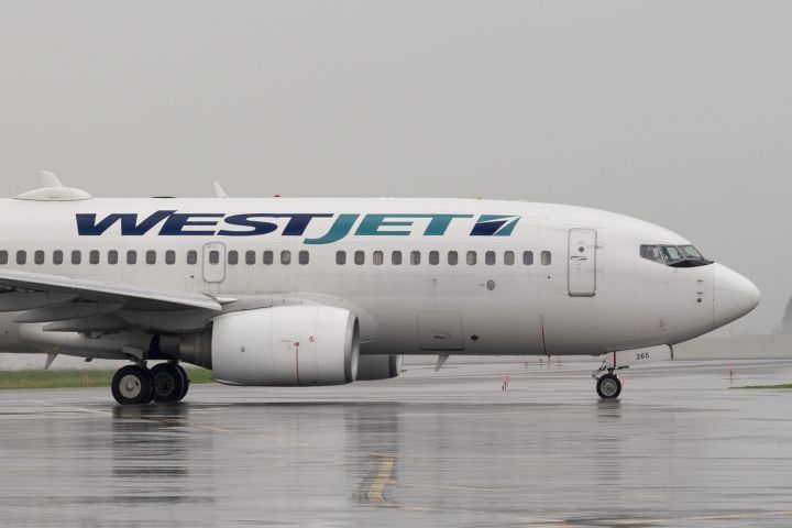 A WestJet airlines plane taxis at the airport Wednesday June 26, 2019 in Ottawa. 
