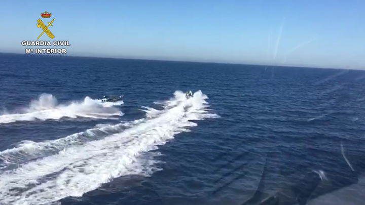 Spanish Civil Guard vessels give chase towards suspected drug smugglers of the coast of Malaga, Spain. 