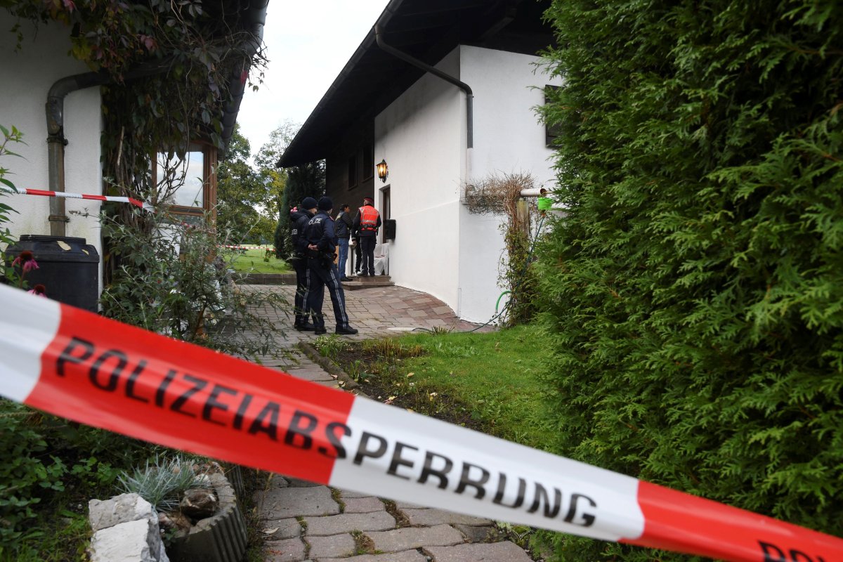 Police officers stand in front of a house where, according to police, five people were found dead in Kitzbuehel, Austria October 6, 2019.  