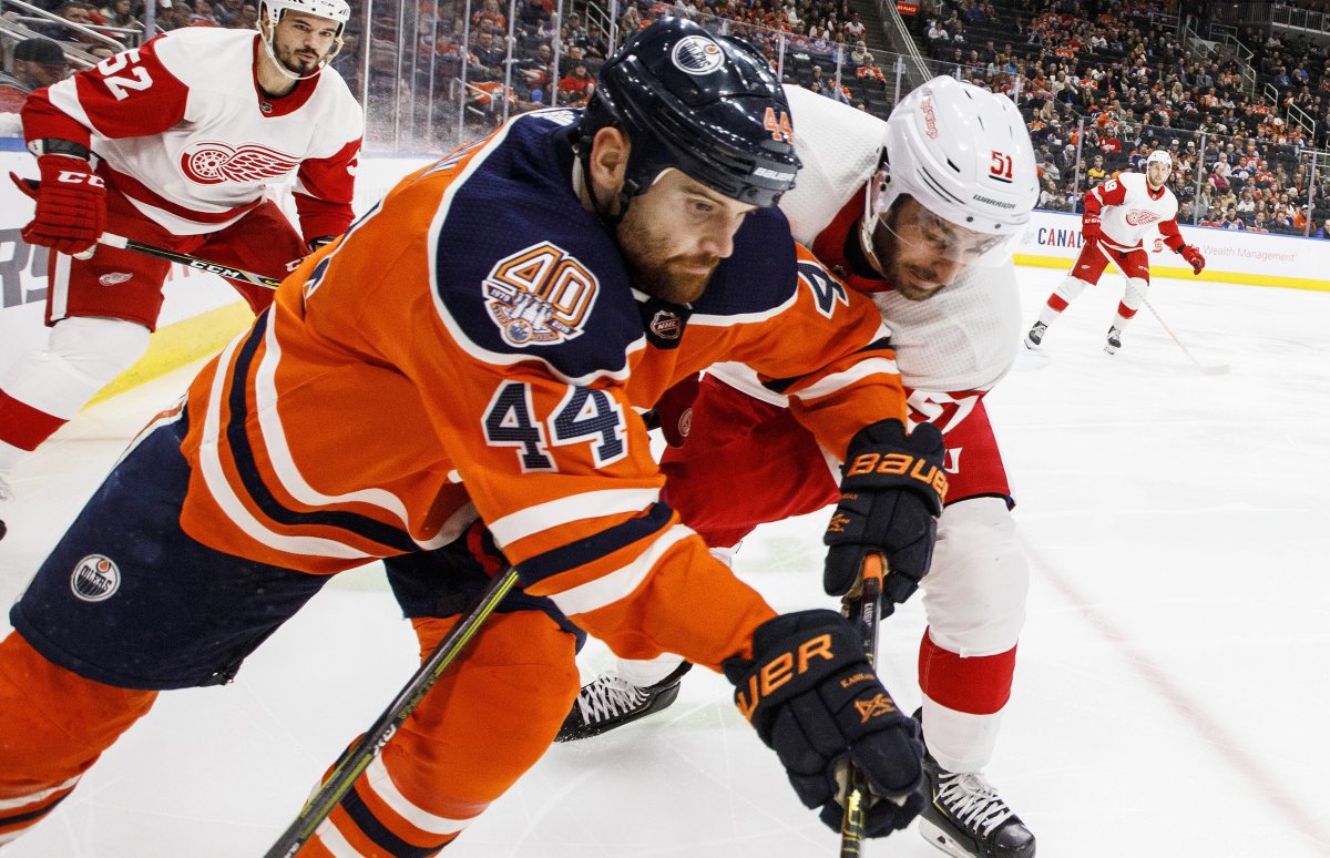 Detroit Red Wings' Frans Nielsen (51) and Edmonton Oilers' Zack Kassian (44) battle for the puck during second period NHL action in Edmonton on Tuesday, Jan. 22, 2019. THE CANADIAN PRESS/Jason Franson.