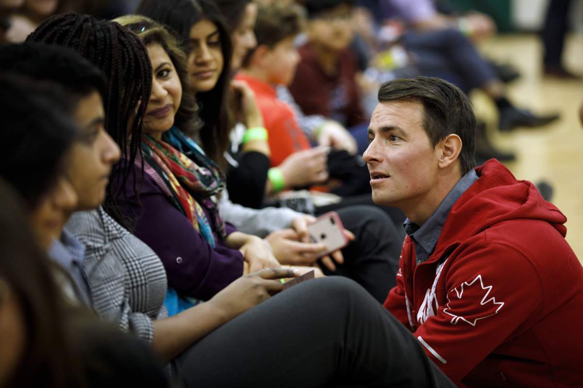 Adam van Koeverden, the Liberal candidate for southern Ontario riding of Milton greets people prior to Prime Minister Justin Trudeau's town hall event in Milton, Ontario on Thursday, Jan. 31, 2019. 