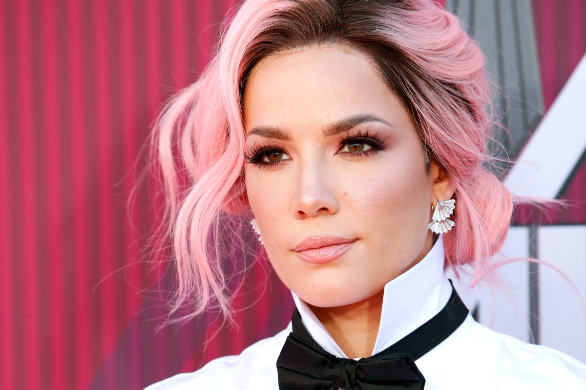 Halsey poses for the photographers as she arrives for the 2019 iHeartRadio Music Awards at the Microsoft Theater in Los Angeles, Calif., on March 14, 2019.