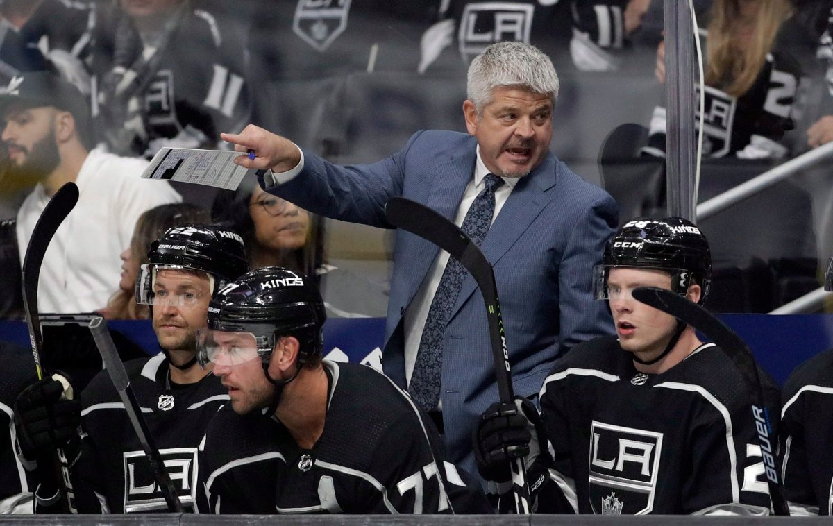 Los Angeles Kings coach Todd McLellan talks to players during the second period of the team's preseason NHL hockey game against the Arizona Coyotes on Tuesday, Sept. 17, 2019, in Los Angeles. (AP Photo/Marcio Jose Sanchez).