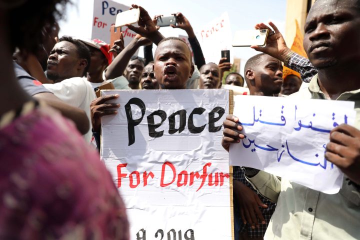 Sudanese protesters hold a banners against war in Darfur region, during a protest calling for the extradition of ousted president Omar Bashir to the International Criminal Court (ICC) in front of the Ministry of Justice in Khartoum, Sudan, 23 September 2019. 