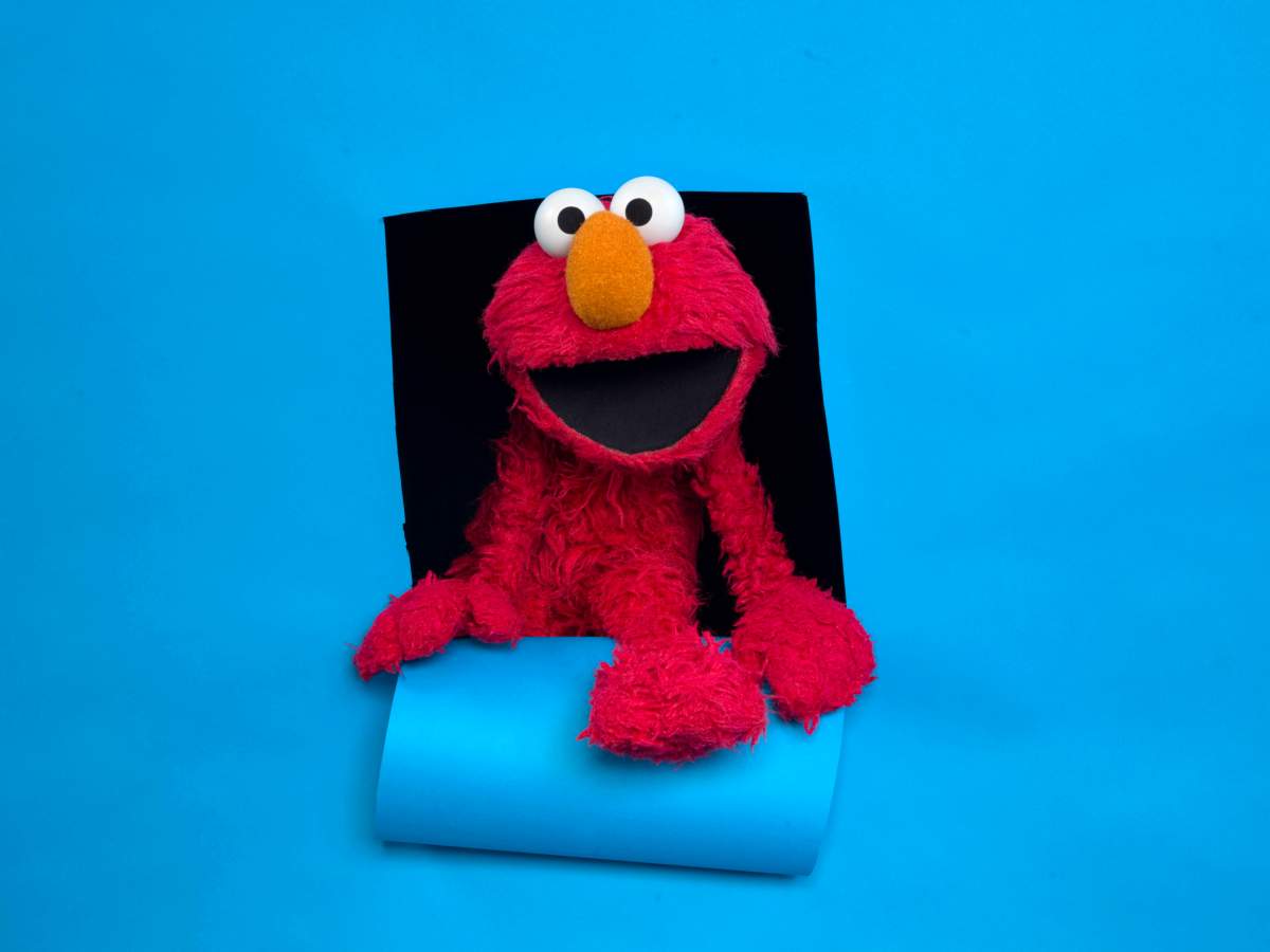 FILE - In this Jan. 24, 2011, file photo, Elmo of the film "Being Elmo" poses for a portrait in the Fender Music Lodge during the 2011 Sundance Film Festival in Park City, Utah.