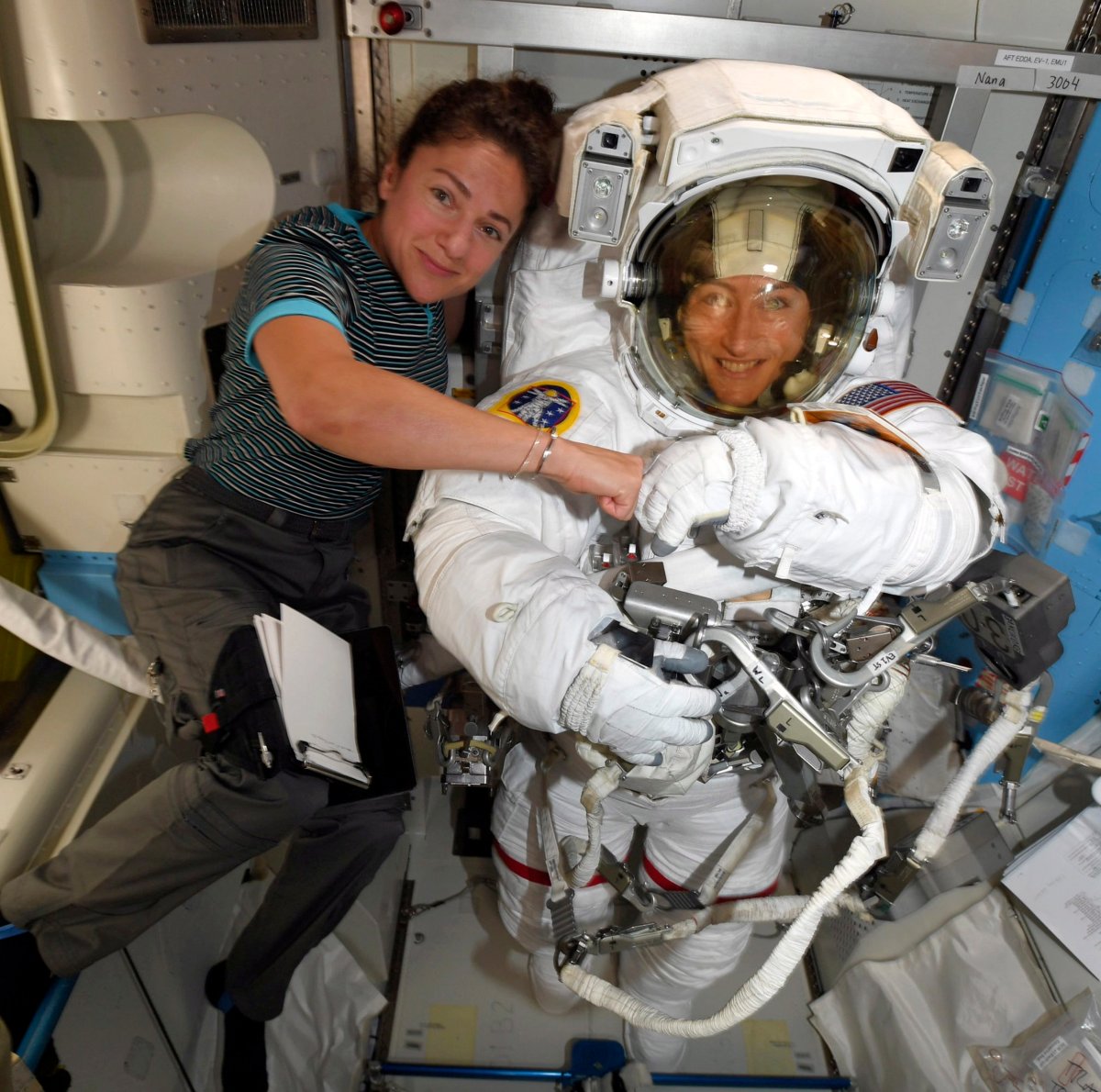 In this image released Friday, Oct. 4, 2019, by NASA, astronauts Christina Koch, right, and, Jessica Meir pose on the International Space Station.