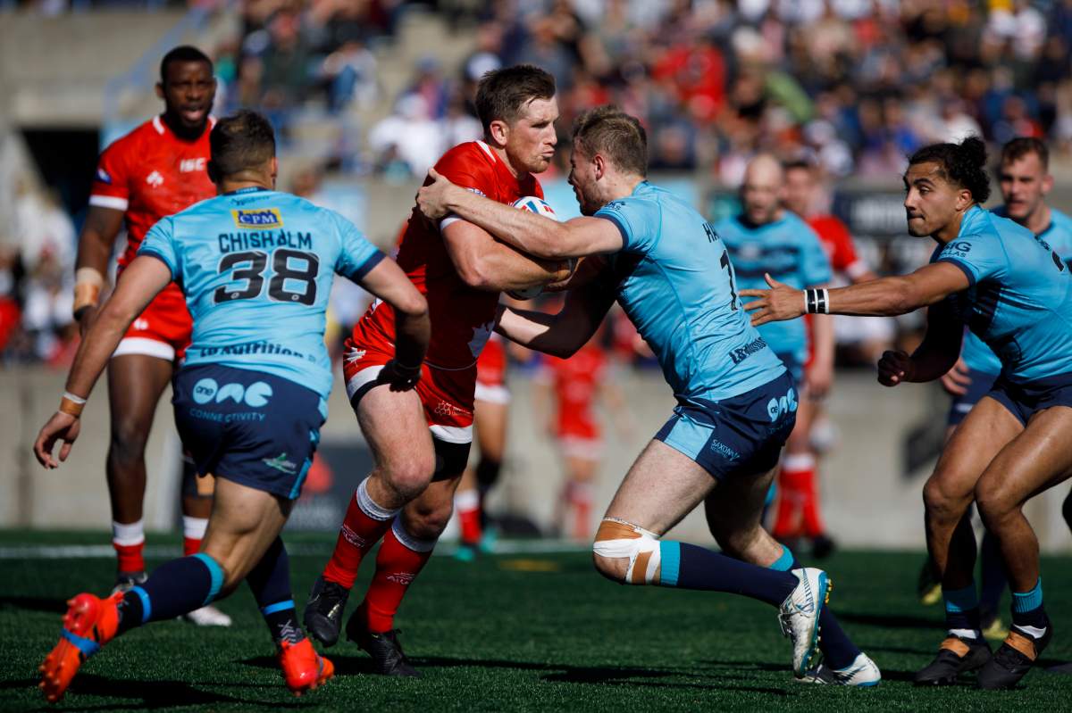 Toronto Wolfpack skipper Josh McCrone pushes through Featherstone Rovers James Harrison as he scores a try during the Million Pound Game in Betfred Championship rugby league action in Toronto, Saturday, Oct. 5, 2019.