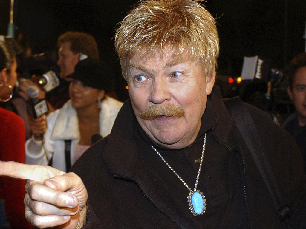 In this Monday, Oct. 21, 2002, file photo, comedian Rip Taylor talks with reporters before a film premiere, in the Hollywood section of Los Angeles. Taylor, the mustached comedian with a fondness for confetti-throwing who became a television game show mainstay in the 1970s, died Sunday, Oct. 6, 2019. He was 84.
