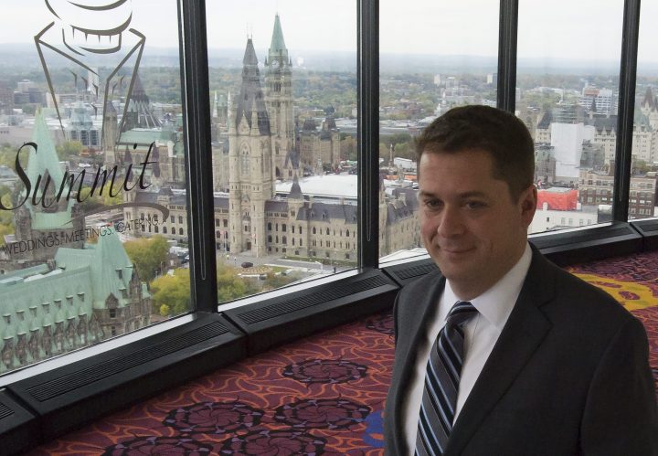 Parliament Hill is pictured in the background as Conservative leader Andrew Scheer arrives for a morning announcement in Ottawa, Oct. 7, 2019.  